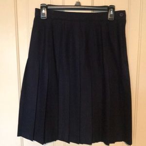 Women’s pleated navy wool skirt.